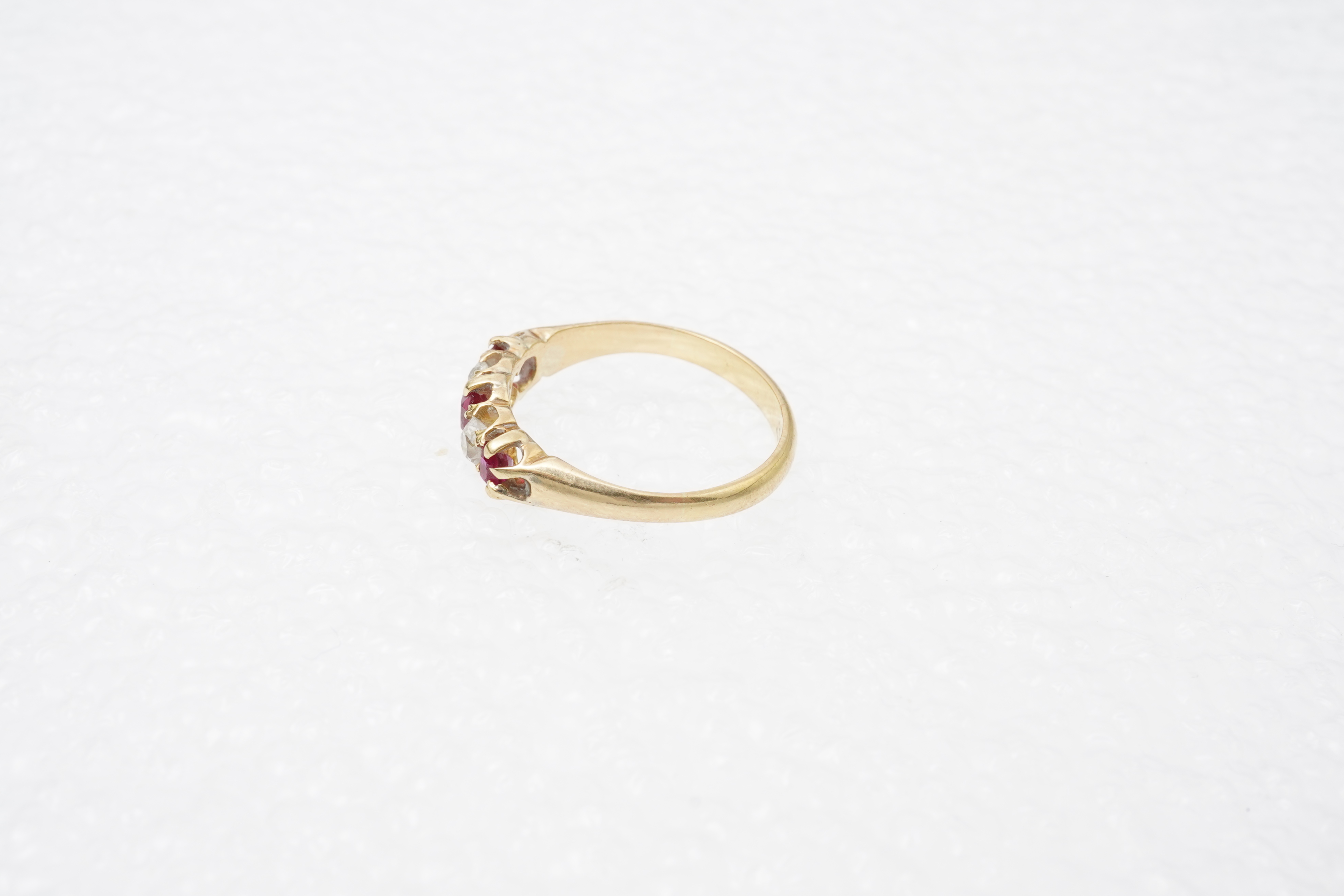A ruby and diamond five-stone ring, circa 1900